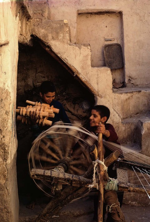 Two Boys with Spinning Wheel, Iran