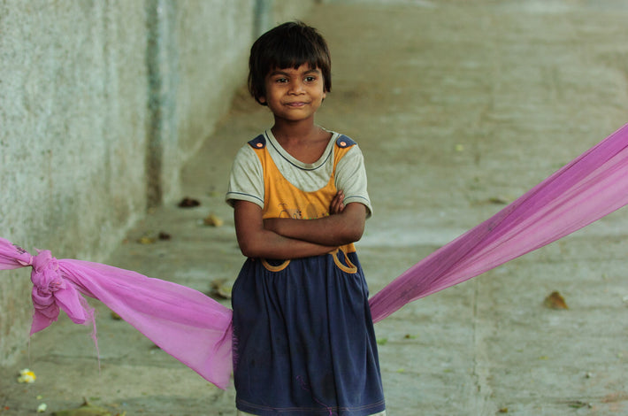 Young Child Leaning on Lavender Cloth, Mumbai