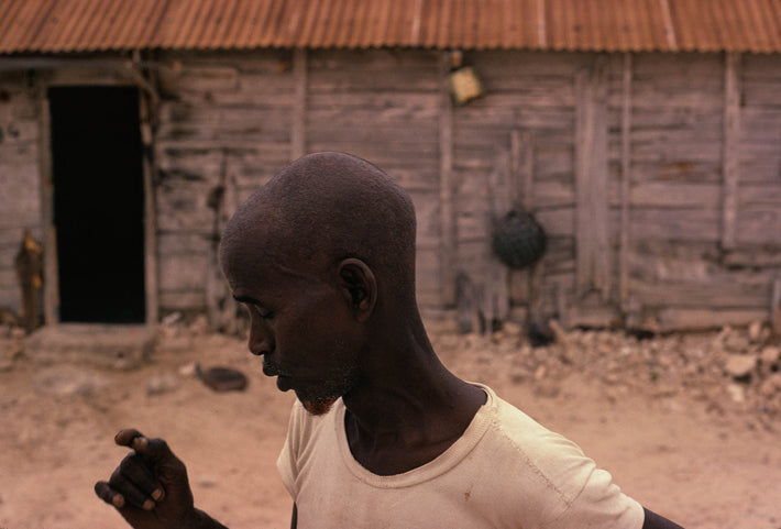 Bald Man Against Side of House, Somalia