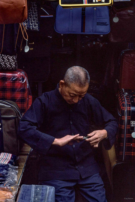 Man Clipping Nails, Singapore