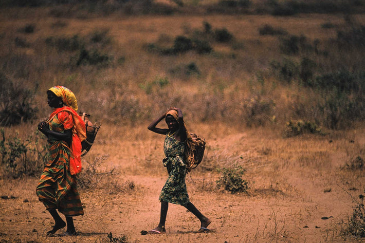 Two Women Walking in Desert