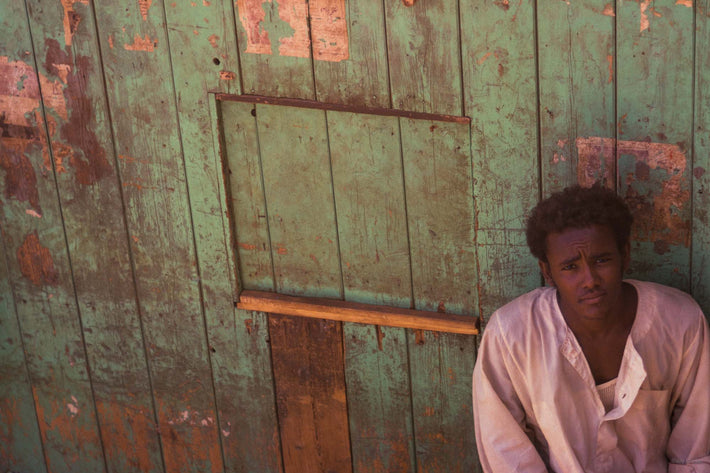 Young Man Against Green Wooden Wall, Somalia