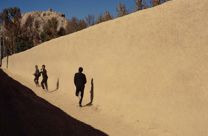 Long Light Wall with Three Boys, Silhouettes, Running, Iran
