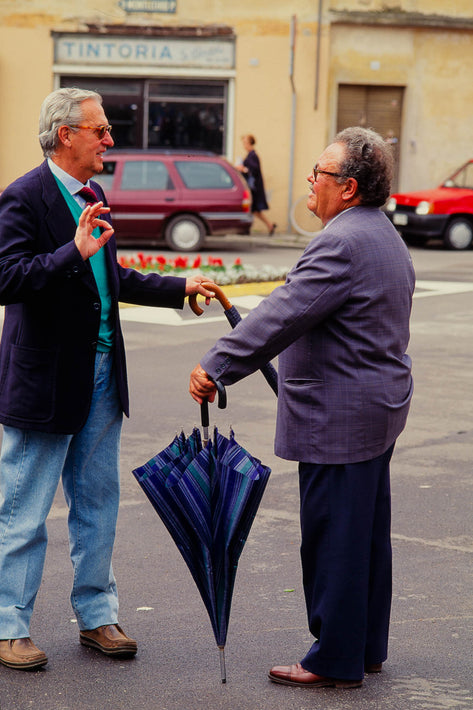 Two Men with Umbrellas, One Making Circle with Fingers, Vicenza