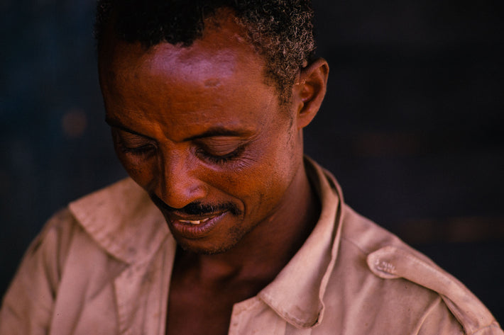 Man with Head Down, Smiling, Somalia