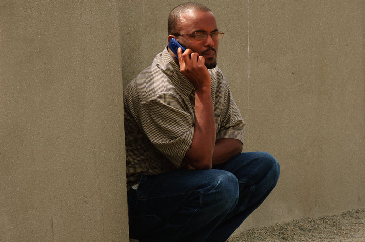 Crouching Man on Phone, Seattle