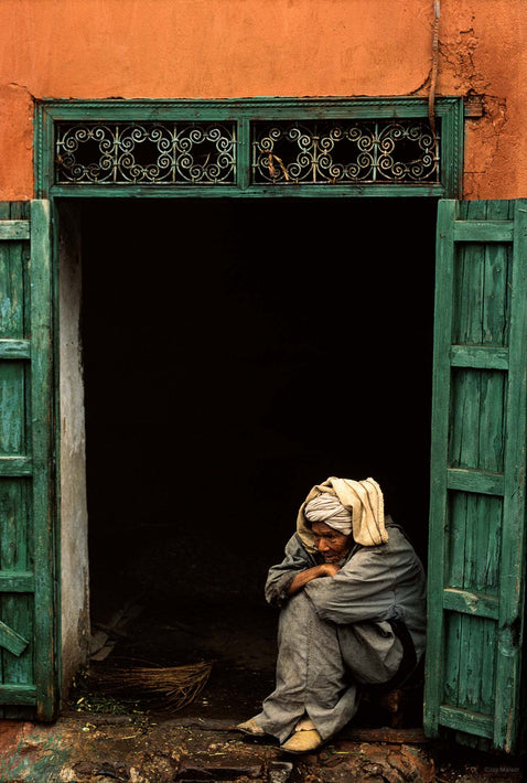 Man Sitting in Open Doorway with Arms on Knees, Marrakech