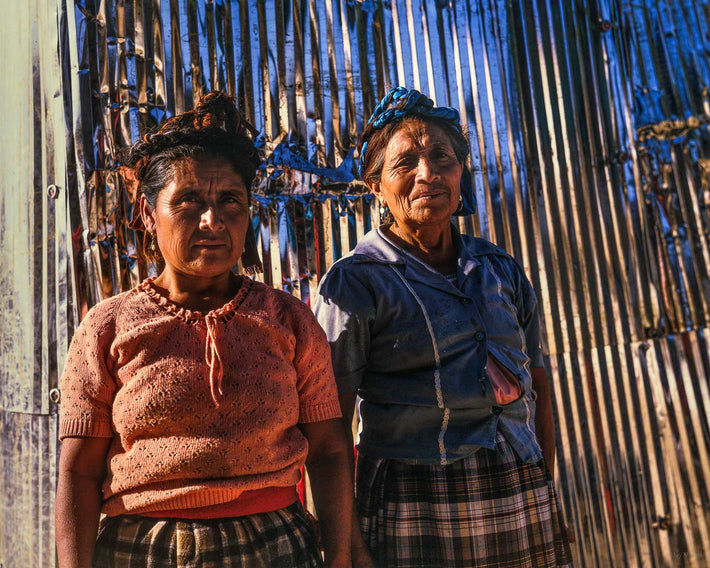 Two Women, Corrugated Wall, Oaxaca