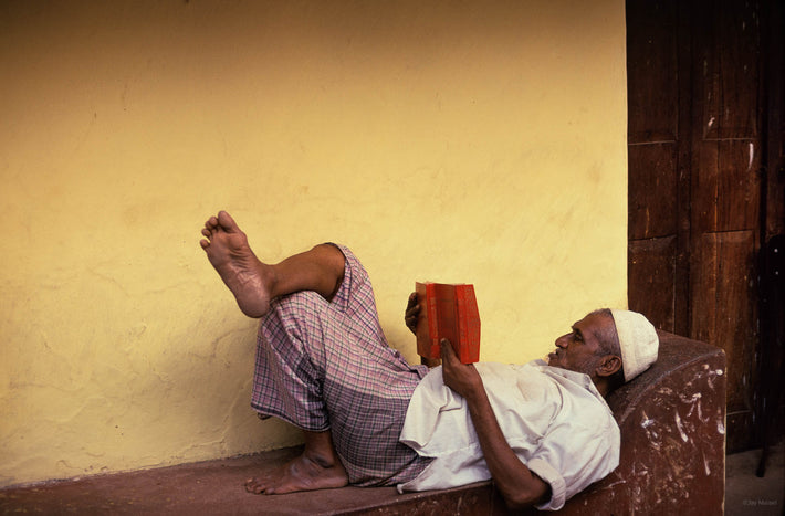 Man Reading on Bench, Kenya