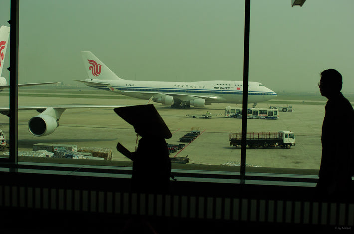 Woman with Hat at Airport, Beijing