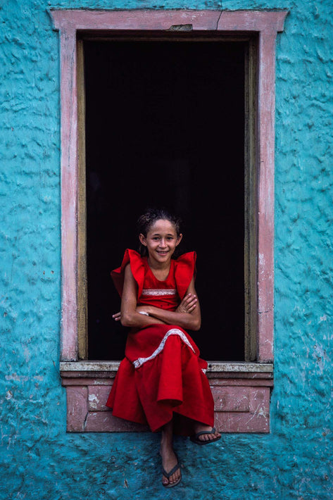 Girl in Red Against Black, Teal Blue Walls, Bahia