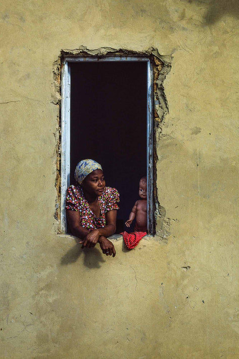 Woman with Doll in Window, Yellowish Wall, Bahia