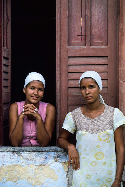 Two Young Women in Window in Front of Building, Bahia