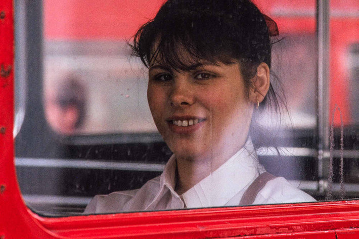 Smiling Young Woman in Bus, London