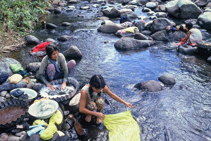 Women with Two Girls Washing Clothes, Philippines