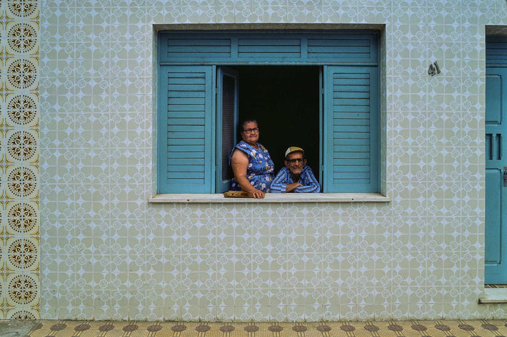 Older Couple in Window, Tiled Wall and Sidewalk, Bahia