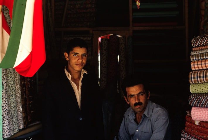 Two Men with Flag in Fabric Store, Iran
