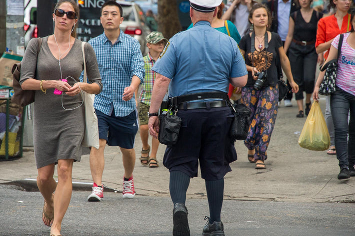 Woman in Grey, Cop in Shorts,  NYC