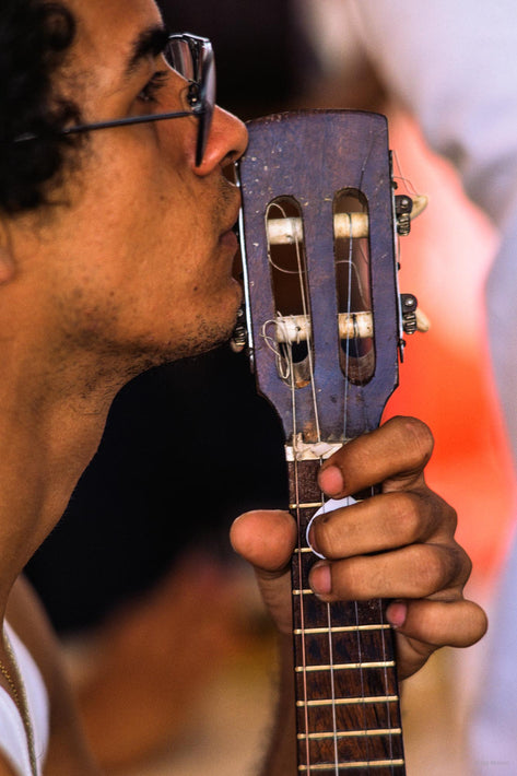 Man with Guitar Held up to Face, Profile, Bahia