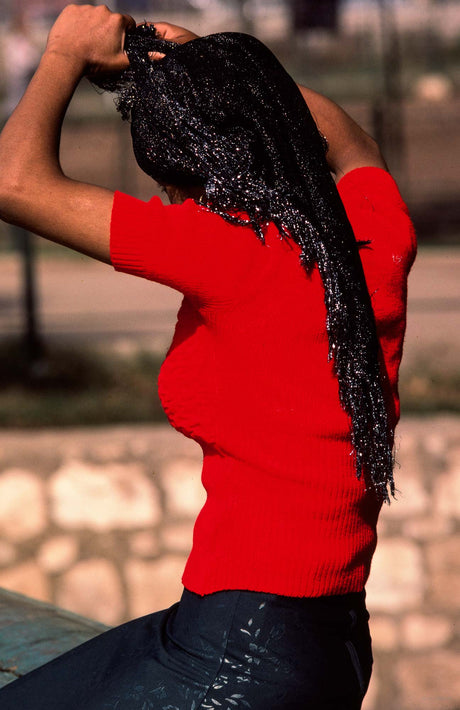 Woman in Red Combing Hair, Egypt
