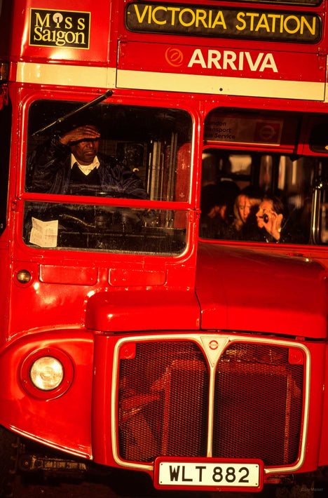 Front of London Bus, Driver Shielding Eyes, London