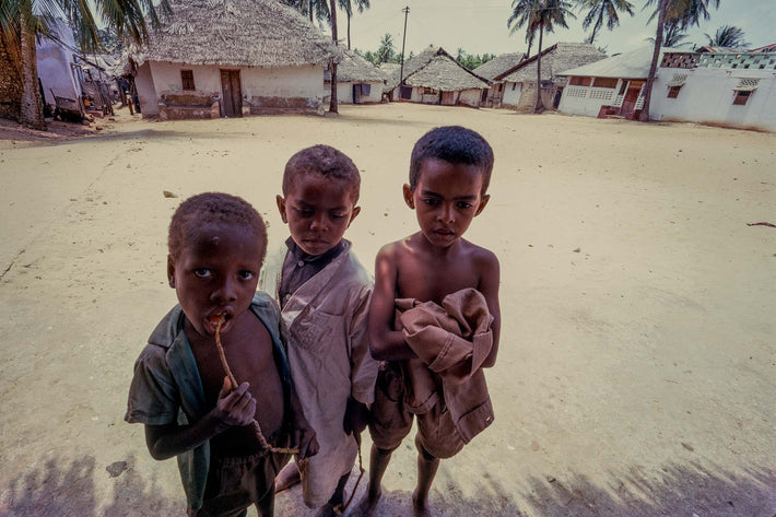 Three Kids, Houses in Background, Kenya