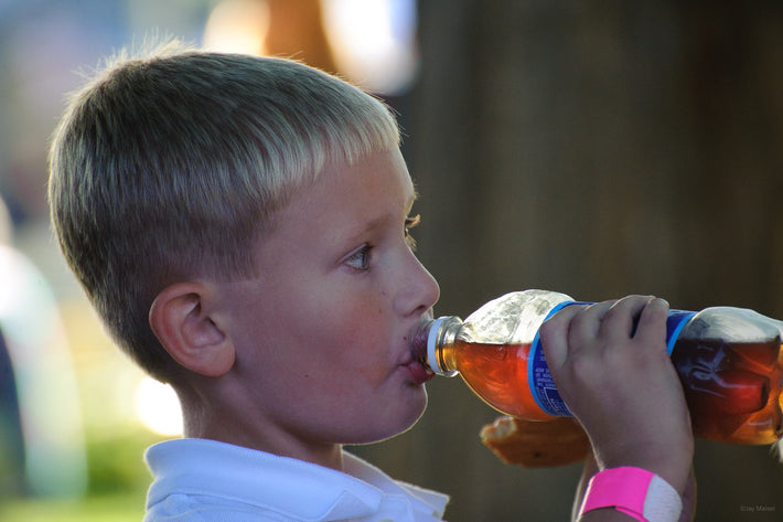 Closeup Young Boy Drinking Soda, Maine