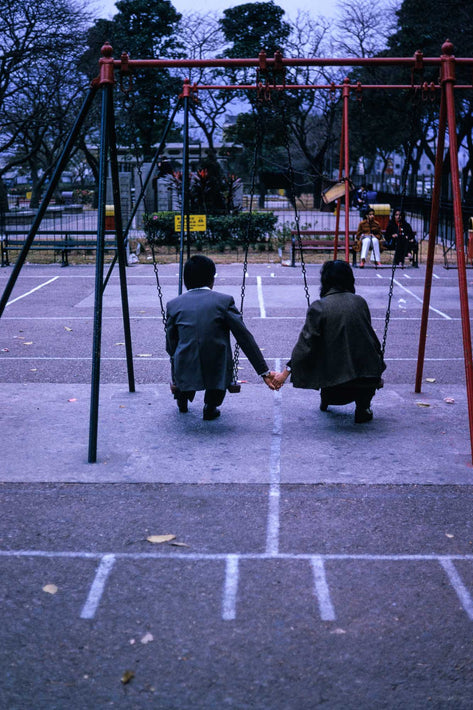 Couple Holding Hands on Swings, Hong Kong